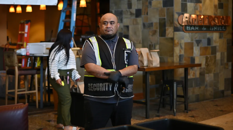A security guard posted at the main entrance of a homeless shelter in Denver in April 2024. Photo: Hyoung Chang/The Denver Post via Getty Images
