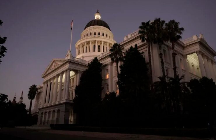 The lights of the state Capitol glow at nighttime in Sacramento